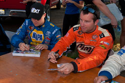 David Mayhews signing autographs before the NASCAR K&N Pro Series race